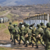 Little green men and lorries after the seizure of Perevalne military base, 9 March 2014 credit Anton Holoborodko- Wikipedia