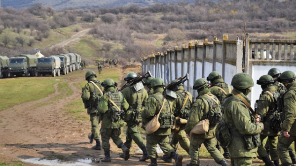 Little green men and lorries after the seizure of Perevalne military base, 9 March 2014 credit Anton Holoborodko- Wikipedia