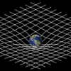 Spacetime -Einstein - Gravity can be thought of as the movements of particles through curved space-time. Credit NASA